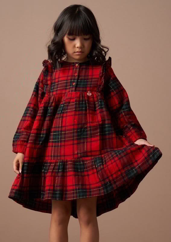 You've never plaid it so good! Look sensational in our tartan dress with cute ruffle detail in an easy to wear sillouette. 