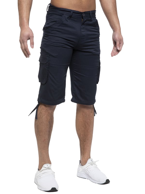 Enzo Mens Cargo Combat Jeans. 7 Pocket Design Including Single Coin Pocket. 2 Front Slash Pockets with Extra Fabric Stitching Detail. 2 Side Cargo Pockets, 2 Back Bellow Pockets with Velcro Fastening Flap. Extra Stitching Details to all Pockets. Adjustable Drawstring to the Hems. Zip Fly Fastening. Premium Quality Fabric Ideal for Casual and Heavy Duty Work Wear.