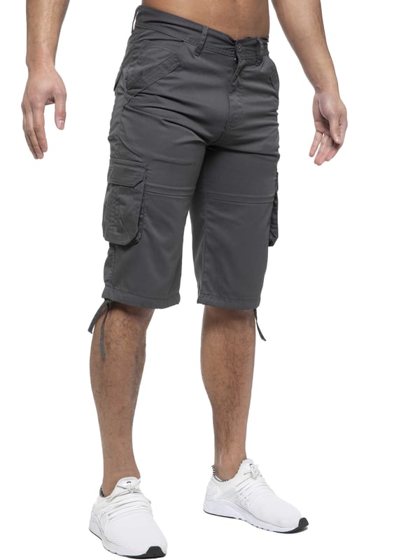 Enzo Mens Cargo Combat Jeans. 7 Pocket Design Including Single Coin Pocket. 2 Front Slash Pockets with Extra Fabric Stitching Detail. 2 Side Cargo Pockets, 2 Back Bellow Pockets with Velcro Fastening Flap. Extra Stitching Details to all Pockets. Adjustable Drawstring to the Hems. Zip Fly Fastening. Premium Quality Fabric Ideal for Casual and Heavy Duty Work Wear.