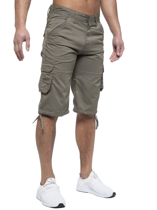 Enzo Mens Cargo Combat Jeans. 7 Pocket Design Including Single Coin Pocket. 2 Front Slash Pockets with Extra Fabric Stitching Detail. 2 Side Cargo Pockets, 2 Back Bellow Pockets with Velcro Fastening Flap. Extra Stitching Details to all Pockets. Adjustable Drawstring to the Hems. Zip Fly Fastening. Premium Quality Fabric Ideal for Casual and Heavy Duty Work Wear.