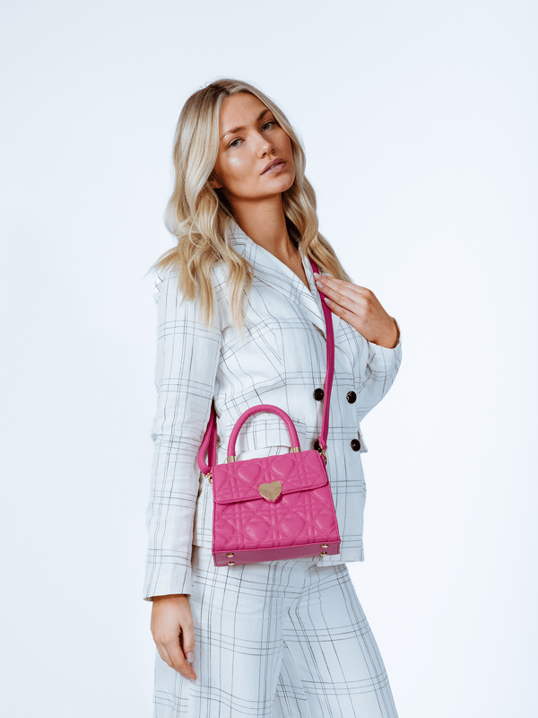 Quilted Heart Grab Bag
Single Grab Handle
Detachable long strap
Top flap mag dot closure
Interior slip pocket
Gold tone metal hardware
Handle drop: max. 60cm
Dimensions: H16cm x W21cm x D10cm
Material: Synthetic