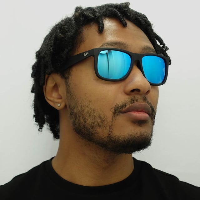 Ray-Ban Sunglasses Justin 4165 622/55 Rubber Black Blue Mirror are inspired by the Original Wayfarer 2140 and are one of the coolest designs throughout the entire Ray-Ban collection. Justin is a bold style that features large, boxy lenses that suit most face shapes and they share the same winged temples as the classic 2140. The propionate plastic frame is super lightweight for comfort and theyâ€™re available in bright, fresh colours as well as the traditional choices. The Ray-Ban Justin is part of the Highstreet collection and are therefore a more affordable choice.