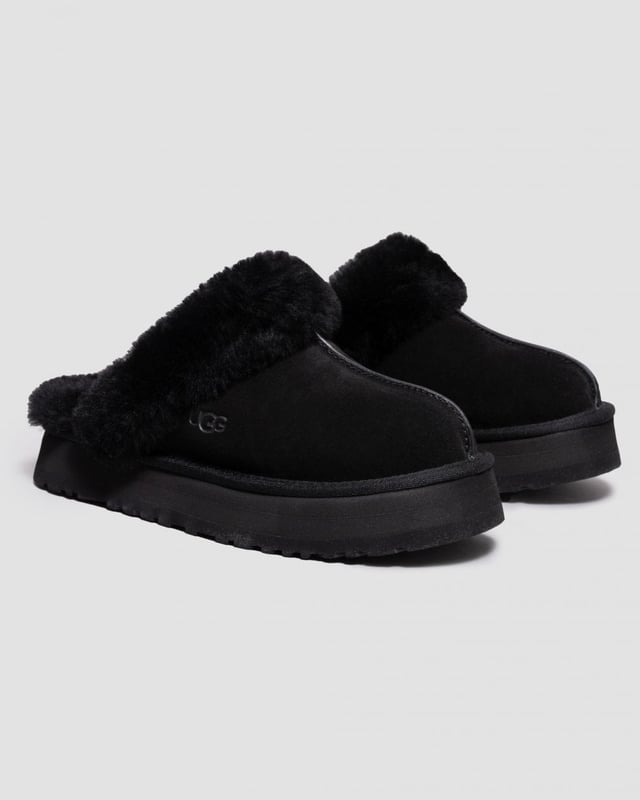 UGG Disquette Womens Slipper Merging the Coquette and Disco styles for a new slipper that's completely unique, the Disquette adds a retro-style platform sole to a familiar slip-on silhouette for outdoor wear, all-day cushion, and a maximalist look.
Crafted from UGG signature sheepskin and suede, this effortless style adds a playful statement to all your favourite outfits, try pairing with jeans or a flowy midi dress.