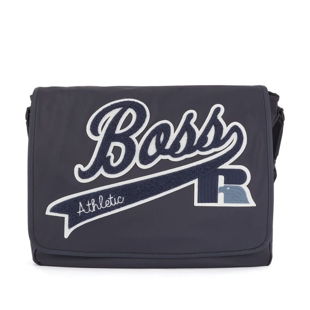 Structured nylon with firm hand feel. Main compartment with flap and velcro closure. Internal zip pocket. Adjustable shoulder strap. Capsule BOSS for Russell Athletic. Dimensions: 40 x 38 x 9 cm. Material: 100% Polyamide. Ref: 50465332410.