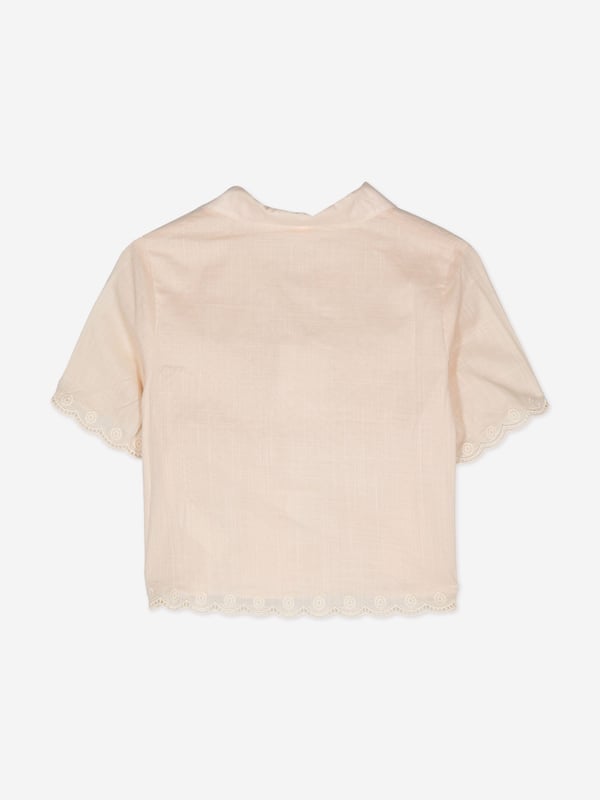 Introducing the elegant Girls Halliday Embroidered Shirt by Zimmermann in pristine Ivory, a sophisticated choice for AW2024. Immaculately designed, this piece blends luxury with whimsical charm, perfect for fashion-forward young girls. Key features include:‚ Exquisite Embroidery: Delicate threading details provide a touch of artisanal craftsmanship.‚ Premium Fabric: Finely woven for durability and softness, guaranteeing comfort and long-lasting wear.‚ Versatile Style: Ideal for both casual and formal occasions, enhancing any outfit with its refined aesthetic.Elevate her wardrobe with the Zimmermann Girls Hallailday Embroidered Shirt in Ivory. Experience unmatched quality and style. Shop now!