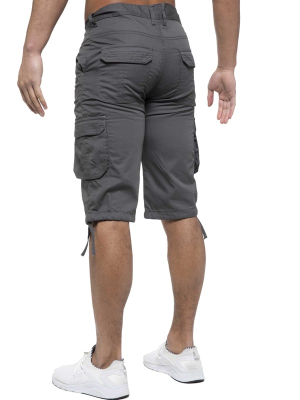 Enzo Mens Cargo Combat Jeans. 7 Pocket Design Including Single Coin Pocket. 2 Front Slash Pockets with Extra Fabric Stitching Detail. 2 Side Cargo Pockets, 2 Back Bellow Pockets with Velcro Fastening Flap. Extra Stitching Details to all Pockets. Adjustable Drawstring to the Hems. Zip Fly Fastening. Premium Quality Fabric Ideal for Casual and Heavy Duty Work Wear.