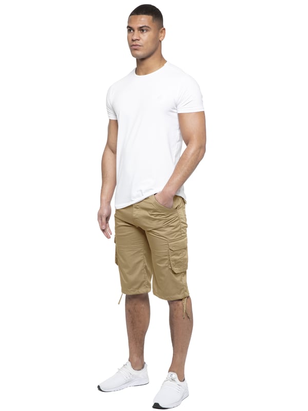 Enzo Mens Cargo Combat Jeans. 7 Pocket Design Including Single Coin Pocket. 2 Front Slash Pockets with Extra Fabric Stitching Detail. 2 Side Cargo Pockets, 2 Back Bellow Pockets with Velcro Fastening Flap. Extra Stitching Details to all Pockets. Adjustable Drawstring to the Hems. Zip Fly Fastening. Premium Quality Fabric Ideal for Casual and Heavy Duty Work Wear.