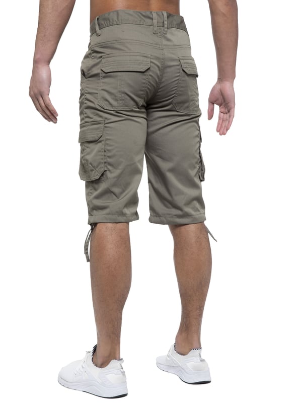 Enzo Mens Cargo Combat Jeans. 7 Pocket Design Including Single Coin Pocket. 2 Front Slash Pockets with Extra Fabric Stitching Detail. 2 Side Cargo Pockets, 2 Back Bellow Pockets with Velcro Fastening Flap. Extra Stitching Details to all Pockets. Adjustable Drawstring to the Hems. Zip Fly Fastening. Premium Quality Fabric Ideal for Casual and Heavy Duty Work Wear.