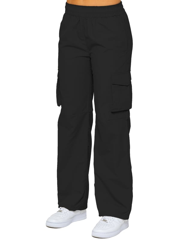 Stay effortlessly stylish in the Enzo Women's Parachute Cargo Pants. Made from lightweight crushed poly fabric, they feature a relaxed fit, wide-leg cut, and an elasticated waistband with adjustable drawstring for all-day comfort. With multiple pockets—including cargo styles with velcro fastening—and adjustable drawcord hems, these utility-inspired trousers blend function with streetwear flair. Ideal for casual, off-duty looks.