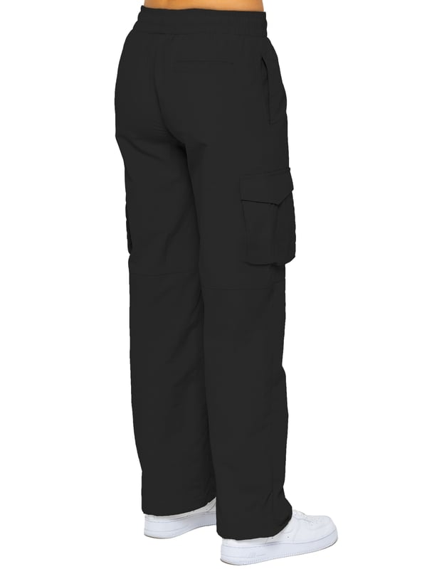 Stay effortlessly stylish in the Enzo Women's Parachute Cargo Pants. Made from lightweight crushed poly fabric, they feature a relaxed fit, wide-leg cut, and an elasticated waistband with adjustable drawstring for all-day comfort. With multiple pockets—including cargo styles with velcro fastening—and adjustable drawcord hems, these utility-inspired trousers blend function with streetwear flair. Ideal for casual, off-duty looks.