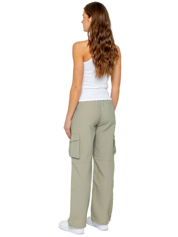 Stay effortlessly stylish in the Enzo Women's Parachute Cargo Pants. Made from lightweight crushed poly fabric, they feature a relaxed fit, wide-leg cut, and an elasticated waistband with adjustable drawstring for all-day comfort. With multiple pockets—including cargo styles with velcro fastening—and adjustable drawcord hems, these utility-inspired trousers blend function with streetwear flair. Ideal for casual, off-duty looks.