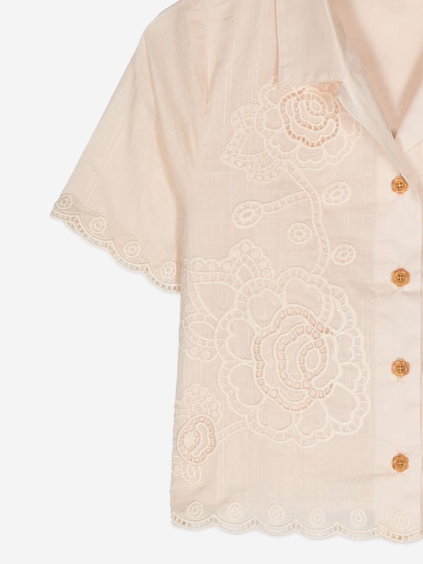 Introducing the elegant Girls Halliday Embroidered Shirt by Zimmermann in pristine Ivory, a sophisticated choice for AW2024. Immaculately designed, this piece blends luxury with whimsical charm, perfect for fashion-forward young girls. Key features include:‚ Exquisite Embroidery: Delicate threading details provide a touch of artisanal craftsmanship.‚ Premium Fabric: Finely woven for durability and softness, guaranteeing comfort and long-lasting wear.‚ Versatile Style: Ideal for both casual and formal occasions, enhancing any outfit with its refined aesthetic.Elevate her wardrobe with the Zimmermann Girls Hallailday Embroidered Shirt in Ivory. Experience unmatched quality and style. Shop now!