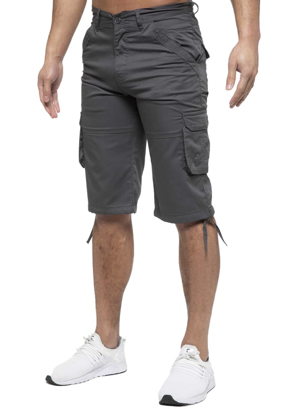 Enzo Mens Cargo Combat Jeans. 7 Pocket Design Including Single Coin Pocket. 2 Front Slash Pockets with Extra Fabric Stitching Detail. 2 Side Cargo Pockets, 2 Back Bellow Pockets with Velcro Fastening Flap. Extra Stitching Details to all Pockets. Adjustable Drawstring to the Hems. Zip Fly Fastening. Premium Quality Fabric Ideal for Casual and Heavy Duty Work Wear.