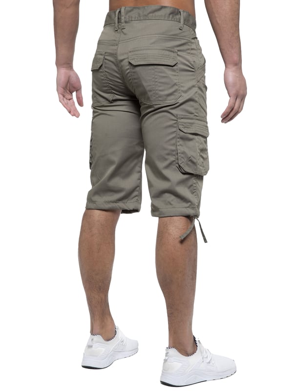 Enzo Mens Cargo Combat Jeans. 7 Pocket Design Including Single Coin Pocket. 2 Front Slash Pockets with Extra Fabric Stitching Detail. 2 Side Cargo Pockets, 2 Back Bellow Pockets with Velcro Fastening Flap. Extra Stitching Details to all Pockets. Adjustable Drawstring to the Hems. Zip Fly Fastening. Premium Quality Fabric Ideal for Casual and Heavy Duty Work Wear.