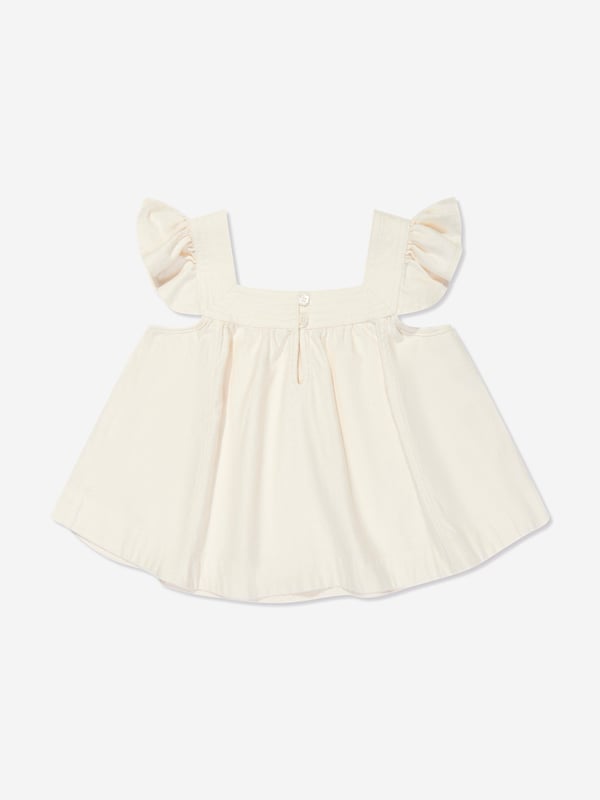 Elevate your child's fashion with the Girls Halliday Denim Top in Ivory by Zimmermann, essential for AW2024. Each detail is carefully crafted to ensure style and comfort: Luxurious Ivory Denim: Crafted in premium ivory denim, perfect for stylish occasions. Chic Minimalist Design: Combines elegance and simplicity, offering versatility and timeless appeal. Exceptional Comfort: Soft fabric ensures comfort throughout the day, ideal for both play and parties.Enhance her wardrobe with the sophistication of Zimmermann. Discover the blend of luxury and playfulness in the Girls Halliday Denim Top. Order now and watch her charm the world in impeccable style!