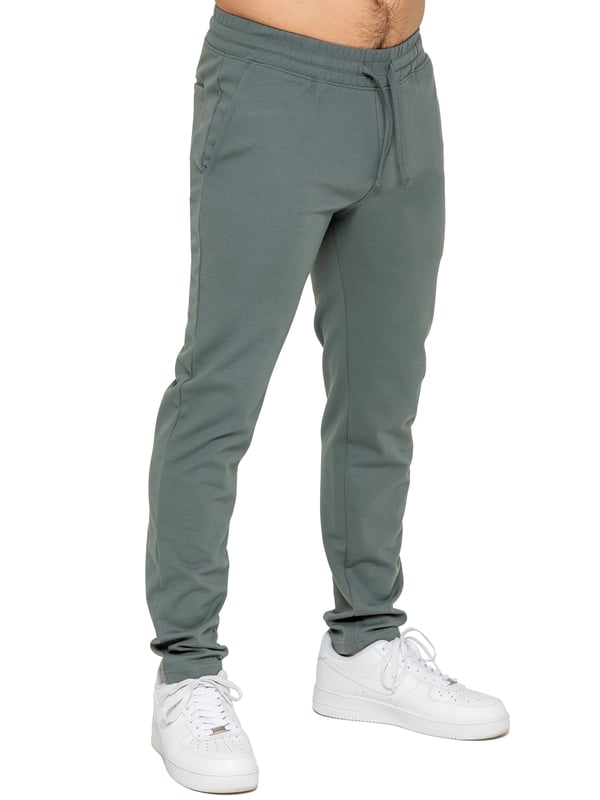 Upgrade your everyday style with the Enzo Smart Stretch Joggers, designed for both comfort and versatility. Featuring an elasticated waistband with an adjustable drawstring, these joggers ensure a secure and personalized fit. The straight-leg design offers a sleek, modern look, while the premium stretch fabric provides ultimate flexibility and all-day comfort. Functional yet stylish, they come with two side entry pockets and two back welt pockets. These joggers are the perfect blend of smart tailoring and relaxed wearability.