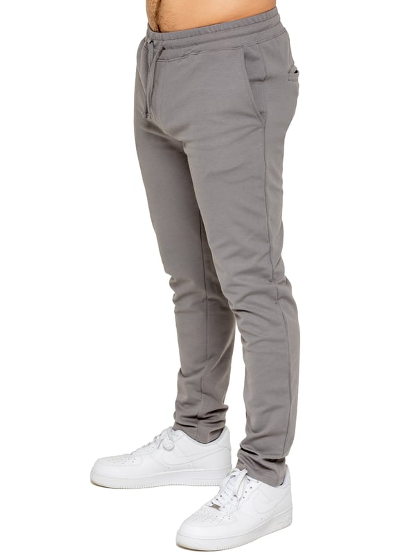 Upgrade your everyday style with the Enzo Smart Stretch Joggers, designed for both comfort and versatility. Featuring an elasticated waistband with an adjustable drawstring, these joggers ensure a secure and personalized fit. The straight-leg design offers a sleek, modern look, while the premium stretch fabric provides ultimate flexibility and all-day comfort. Functional yet stylish, they come with two side entry pockets and two back welt pockets. These joggers are the perfect blend of smart tailoring and relaxed wearability.