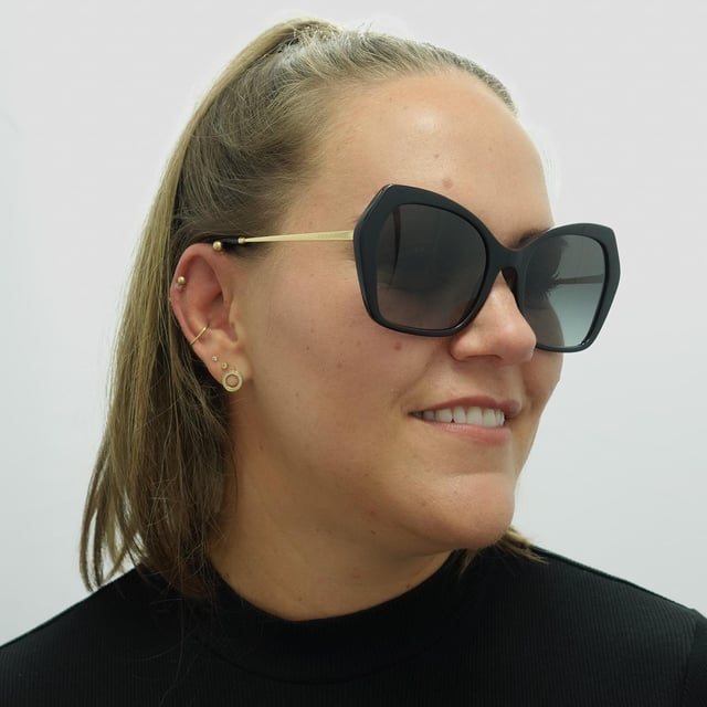 Dolce & Gabbana Butterfly Females Black Grey Gradient DG4399  Sunglasses are a fashionable and trendy eyewear option for Female from the luxury fashion brand. With a chic square frame made of high-quality acetate, these sunglasses feature tinted lenses that provide 100% UV protection. The unique gold-tone temple detailing with the iconic Dolce & Gabbana logo adds a touch of glamour and sophistication to the design, making them a perfect accessory for style-conscious Female.