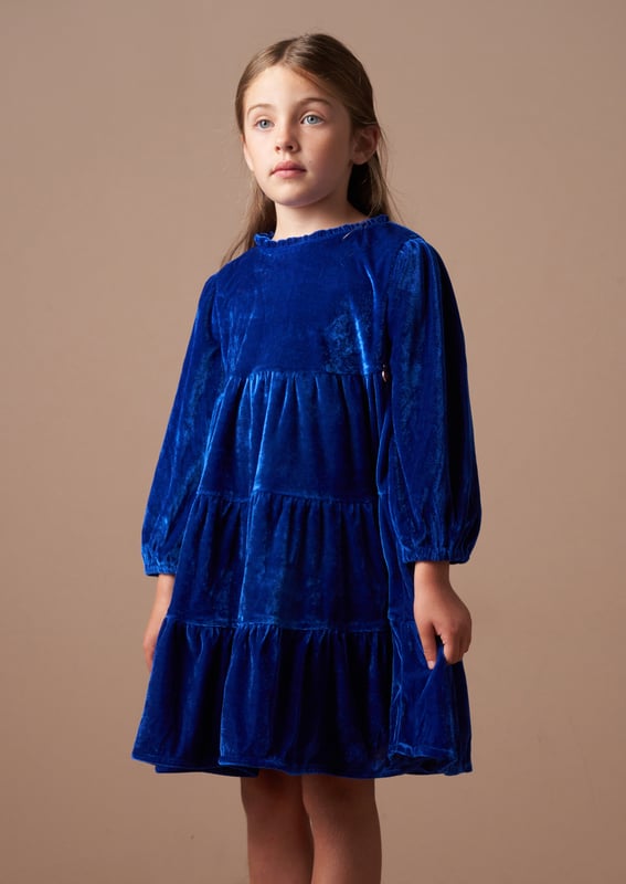 Get ready for seasonal celebrations with this rich blue velvet tiered dress. In a classic colour with a long sleeve and lots of volume through the skirt, it's stunning.