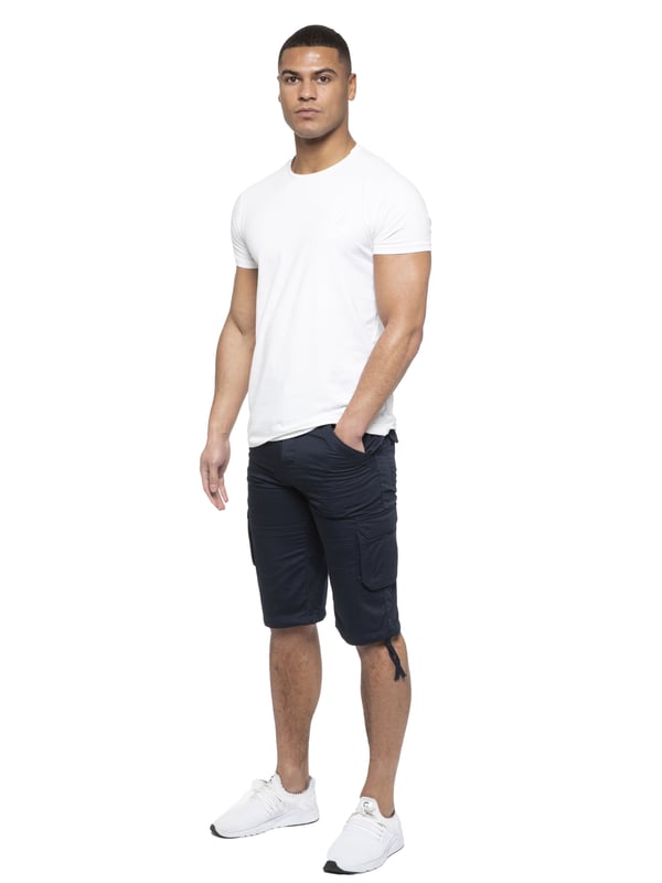 Enzo Mens Cargo Combat Jeans. 7 Pocket Design Including Single Coin Pocket. 2 Front Slash Pockets with Extra Fabric Stitching Detail. 2 Side Cargo Pockets, 2 Back Bellow Pockets with Velcro Fastening Flap. Extra Stitching Details to all Pockets. Adjustable Drawstring to the Hems. Zip Fly Fastening. Premium Quality Fabric Ideal for Casual and Heavy Duty Work Wear.