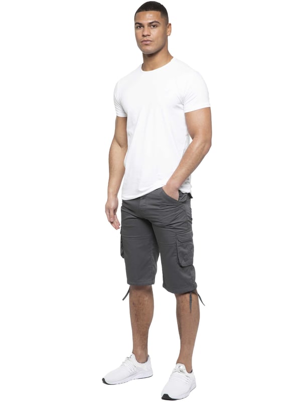 Enzo Mens Cargo Combat Jeans. 7 Pocket Design Including Single Coin Pocket. 2 Front Slash Pockets with Extra Fabric Stitching Detail. 2 Side Cargo Pockets, 2 Back Bellow Pockets with Velcro Fastening Flap. Extra Stitching Details to all Pockets. Adjustable Drawstring to the Hems. Zip Fly Fastening. Premium Quality Fabric Ideal for Casual and Heavy Duty Work Wear.