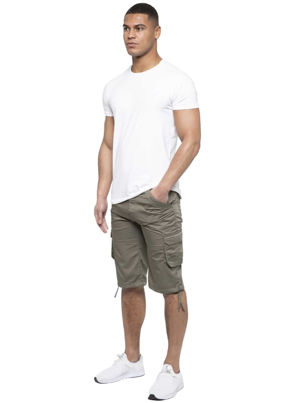 Enzo Mens Cargo Combat Jeans. 7 Pocket Design Including Single Coin Pocket. 2 Front Slash Pockets with Extra Fabric Stitching Detail. 2 Side Cargo Pockets, 2 Back Bellow Pockets with Velcro Fastening Flap. Extra Stitching Details to all Pockets. Adjustable Drawstring to the Hems. Zip Fly Fastening. Premium Quality Fabric Ideal for Casual and Heavy Duty Work Wear.