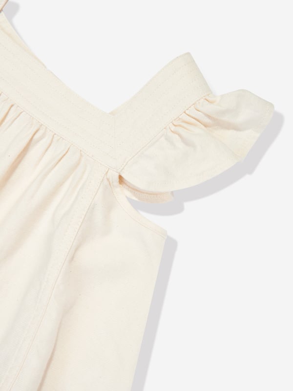 Elevate your child's fashion with the Girls Halliday Denim Top in Ivory by Zimmermann, essential for AW2024. Each detail is carefully crafted to ensure style and comfort: Luxurious Ivory Denim: Crafted in premium ivory denim, perfect for stylish occasions. Chic Minimalist Design: Combines elegance and simplicity, offering versatility and timeless appeal. Exceptional Comfort: Soft fabric ensures comfort throughout the day, ideal for both play and parties.Enhance her wardrobe with the sophistication of Zimmermann. Discover the blend of luxury and playfulness in the Girls Halliday Denim Top. Order now and watch her charm the world in impeccable style!