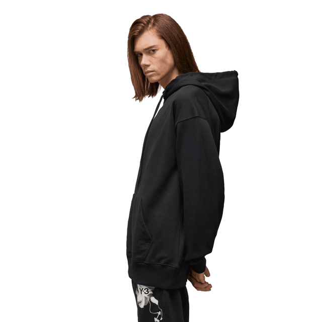 Y-3 Graphic French Terry Hoodie in black. The Y-3 Graphic French Terry Hoodie blends essential everyday wear with graphic style. An abstract floral print sits on the chest and wraps the sleeve. Cotton French terry fabricates a relaxed build  and a kangaroo pocket emphasises laid-back comfort.- A casual Y-3 hoodie.- Regular fit.- Drawcord-adjustable hood.- Long sleeves with drop shoulder.- Kangaroo pocket.- Ribbed cuffs and hem.- Y-3 logo.- 80% cotton  20% polyester (recycled).  Machine washable.- Ref: IN4335