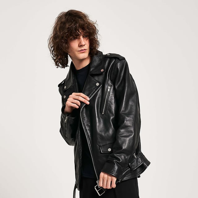 Barneys Originals real leather belted asymmetric biker jacket. Designed with a fixed belt, so you never have to worry about losing it. Finished with silver trims for a cool, edgy look.
