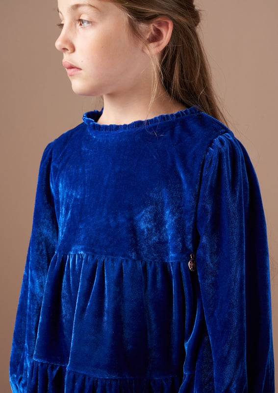 Get ready for seasonal celebrations with this rich blue velvet tiered dress. In a classic colour with a long sleeve and lots of volume through the skirt, it's stunning.