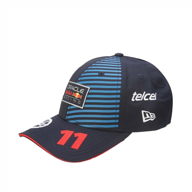 New Era Red Bull Racing Sergio Perez 9FORTY Cap in blue.- Adjustable strap at the back.- Curved brim.- New Era logo is proudly displayed on the front of the cap  highlighting the brand's iconic  timeless design.- Lightweight and breathable.- 100% Cotton.- Ref: 60504672