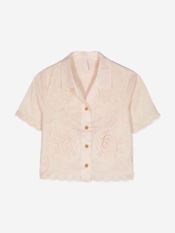 Introducing the elegant Girls Halliday Embroidered Shirt by Zimmermann in pristine Ivory, a sophisticated choice for AW2024. Immaculately designed, this piece blends luxury with whimsical charm, perfect for fashion-forward young girls. Key features include:‚ Exquisite Embroidery: Delicate threading details provide a touch of artisanal craftsmanship.‚ Premium Fabric: Finely woven for durability and softness, guaranteeing comfort and long-lasting wear.‚ Versatile Style: Ideal for both casual and formal occasions, enhancing any outfit with its refined aesthetic.Elevate her wardrobe with the Zimmermann Girls Hallailday Embroidered Shirt in Ivory. Experience unmatched quality and style. Shop now!