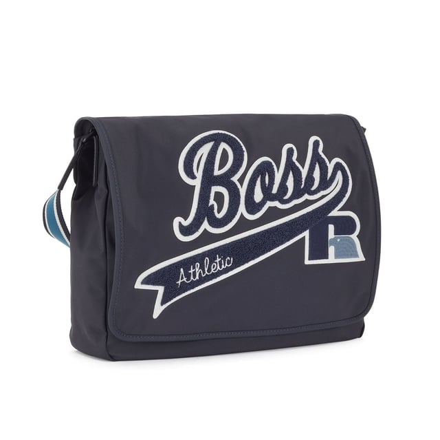 Structured nylon with firm hand feel. Main compartment with flap and velcro closure. Internal zip pocket. Adjustable shoulder strap. Capsule BOSS for Russell Athletic. Dimensions: 40 x 38 x 9 cm. Material: 100% Polyamide. Ref: 50465332410.