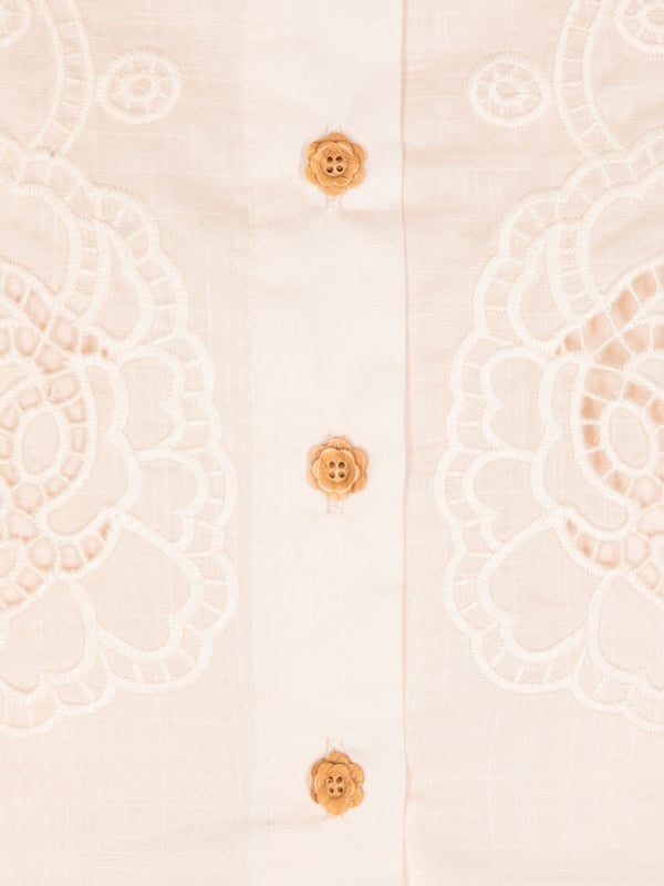Introducing the elegant Girls Halliday Embroidered Shirt by Zimmermann in pristine Ivory, a sophisticated choice for AW2024. Immaculately designed, this piece blends luxury with whimsical charm, perfect for fashion-forward young girls. Key features include:‚ Exquisite Embroidery: Delicate threading details provide a touch of artisanal craftsmanship.‚ Premium Fabric: Finely woven for durability and softness, guaranteeing comfort and long-lasting wear.‚ Versatile Style: Ideal for both casual and formal occasions, enhancing any outfit with its refined aesthetic.Elevate her wardrobe with the Zimmermann Girls Hallailday Embroidered Shirt in Ivory. Experience unmatched quality and style. Shop now!