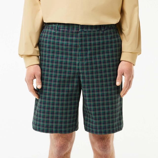 Men's Lacoste Sport Ultra-Dry checked Golf Bermuda Shorts.- Non-slip gripper tape holds top in place.- Relaxed, comfortable fit.- Ball and notebook pockets.- Elasticated waist.- Silicone crocodile. Material: 100% Polyester. Ref: FH7424IQ6.