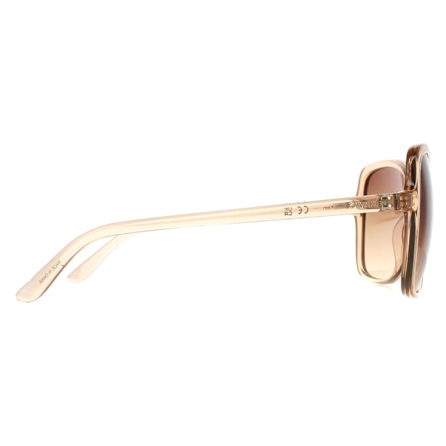 Calvin Klein Butterfly Womens Crystal Beige Brown Gradient CK19561S  CK19561S have a gorgeous butterfly shape frame made from lightweight acetate. The oversized frame is super chic and features Calvin Klein branding along the temples.