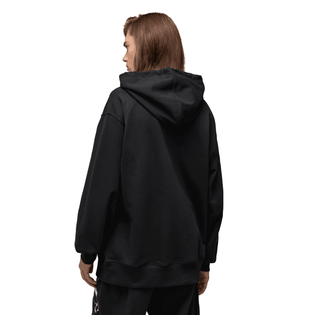 Y-3 Graphic French Terry Hoodie in black. The Y-3 Graphic French Terry Hoodie blends essential everyday wear with graphic style. An abstract floral print sits on the chest and wraps the sleeve. Cotton French terry fabricates a relaxed build  and a kangaroo pocket emphasises laid-back comfort.- A casual Y-3 hoodie.- Regular fit.- Drawcord-adjustable hood.- Long sleeves with drop shoulder.- Kangaroo pocket.- Ribbed cuffs and hem.- Y-3 logo.- 80% cotton  20% polyester (recycled).  Machine washable.- Ref: IN4335
