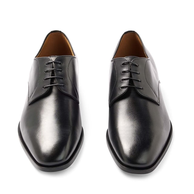 Mens BOSS Lisbon Derby Shoes in black.- Made in Italy.- Premium BOSS business footwear.- Derby upper design in soft leather with stitching details.- Soft cognac lining and a comfortable insole for maximum cushioning and leather sole for a characterful effect.- RESPONSIBLE STYLE- Ref: 50470980-001
