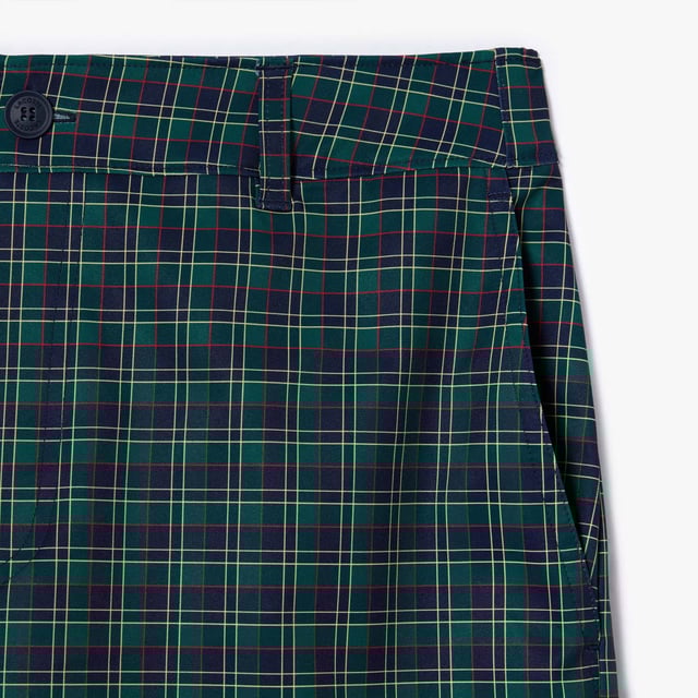 Men's Lacoste Sport Ultra-Dry checked Golf Bermuda Shorts.- Non-slip gripper tape holds top in place.- Relaxed, comfortable fit.- Ball and notebook pockets.- Elasticated waist.- Silicone crocodile. Material: 100% Polyester. Ref: FH7424IQ6.