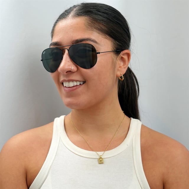 Ray-Ban Sunglasses Aviator 3025 L2823 Black Green were originally designed in 1936 for US military pilots and have since become one of the most iconic sunglasses models in the world. The timeless design is characterised by the thin metal wire frame, large teardrop shaped lenses and fine metal temples that feature silicone tips and nose pads for a customised and comfortable fit. This classic model is available in various sizes and an array of colourways.