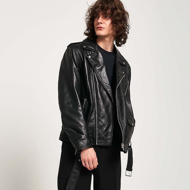 Barneys Originals real leather belted asymmetric biker jacket. Designed with a fixed belt, so you never have to worry about losing it. Finished with silver trims for a cool, edgy look.