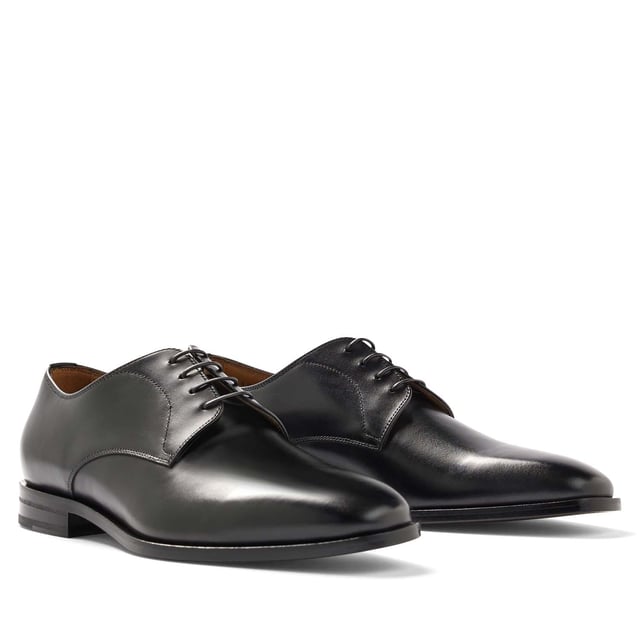 Mens BOSS Lisbon Derby Shoes in black.- Made in Italy.- Premium BOSS business footwear.- Derby upper design in soft leather with stitching details.- Soft cognac lining and a comfortable insole for maximum cushioning and leather sole for a characterful effect.- RESPONSIBLE STYLE- Ref: 50470980-001