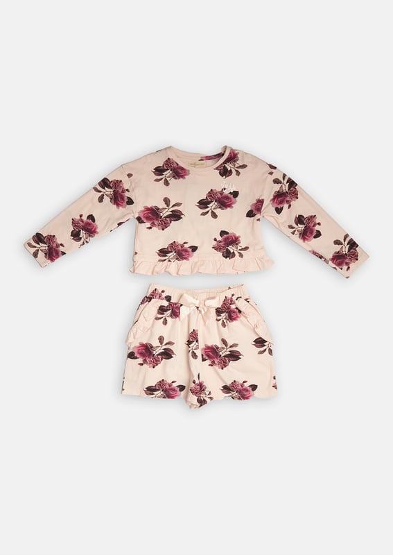 Hit the snooze button! This pyjama set is made with a supersoft cotton jersey. With an all-over beautiful bloom print and pretty ruffle details match perfectly with comfortable elasticated waist shorts.   About me: 100% Cotton Look after me: Think planet. wash at 30c.